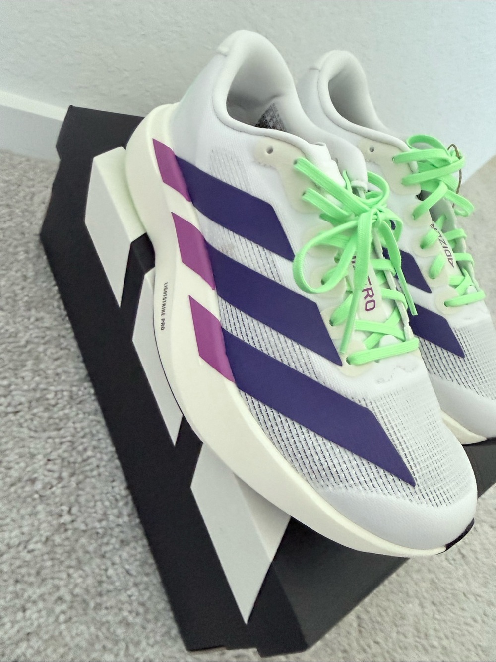 adidas White Sneakers with Purple Stripes and Neon Green Laces